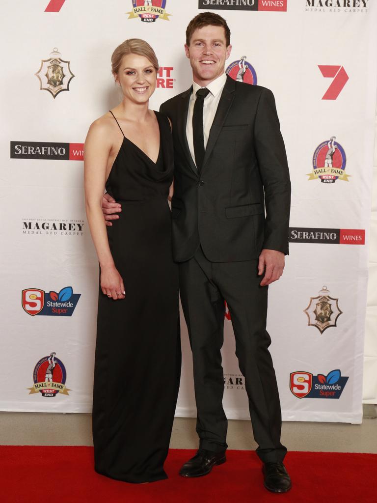 Teegan Boase wearing Keepsake, and Jonathan Beech pose for a picture on the red carpet at Adelaide Oval in North Adelaide, for the Magarey Medal, Monday, September 9, 2019. Picture: Matt Loxton