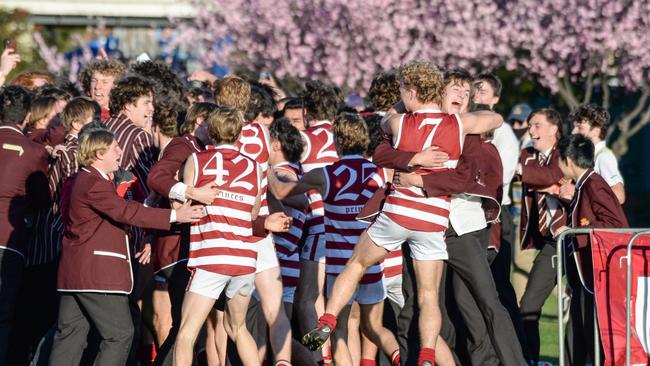 The Reds celebrate their big Intercol win with fellow students. The home crowd was overjoyed when the final siren sounded. Picture: Brenton Edwards