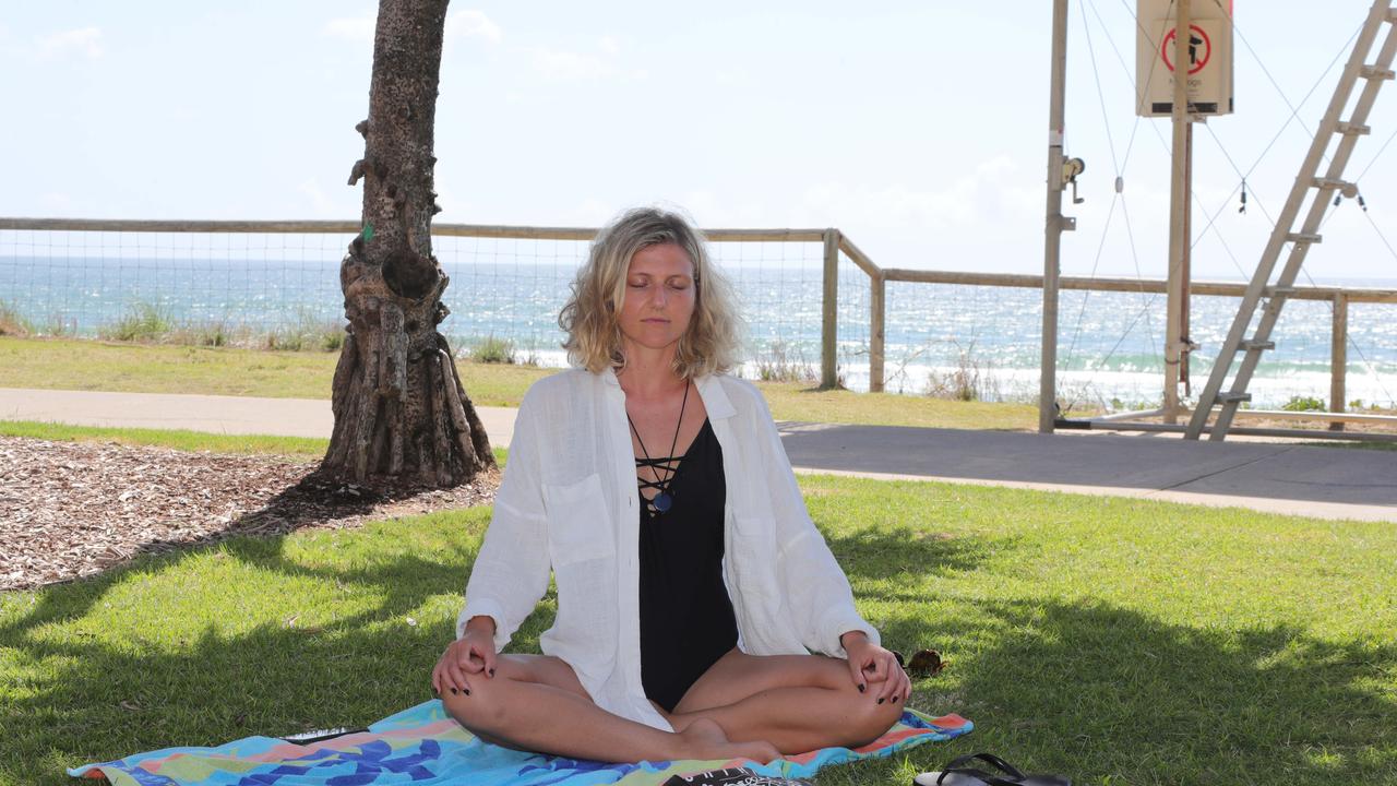 Sara Klank from Worongary meditating. Picture Glenn Hampson