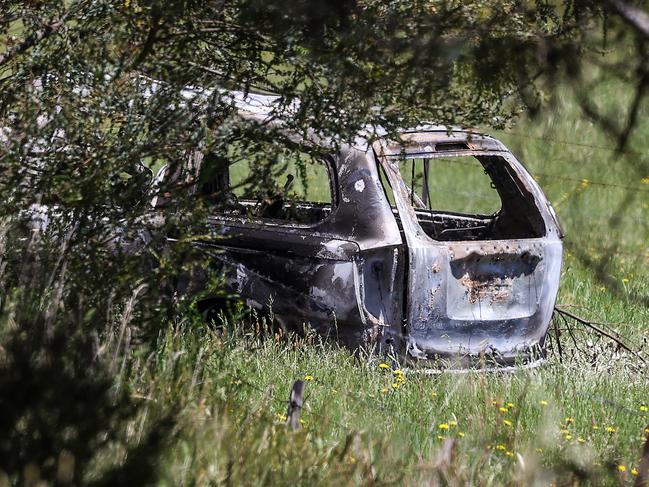 The burnt-out shell of what is believed to be a Kia Carnival. Picture: Ian Currie