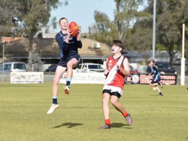 The pair loved their footy. Picture: Supplied.