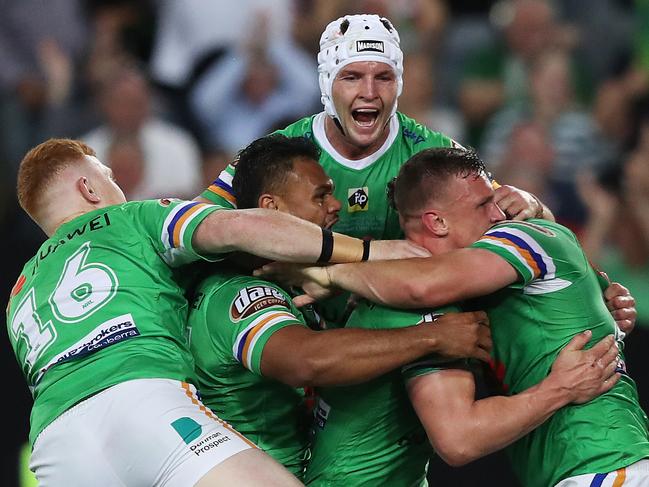 Canberra players celebrate a try by Canberra's Jack Wighton during the 2019 NRL Grand Final between the Sydney Roosters and Canberra Raiders at ANZ Stadium, Sydney. Picture: Brett Costello