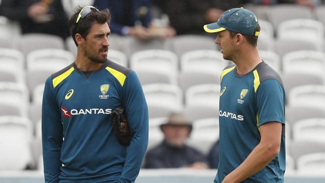 Australia's Mitchell Starc, left speaks to Australia's Josh Hazlewood as they walks from the pitch as rain delays play on day one of the 2nd Ashes Test cricket match between England and Australia at Lord's cricket ground in London, Wednesday, Aug. 14, 2019. (AP Photo/Alastair Grant)