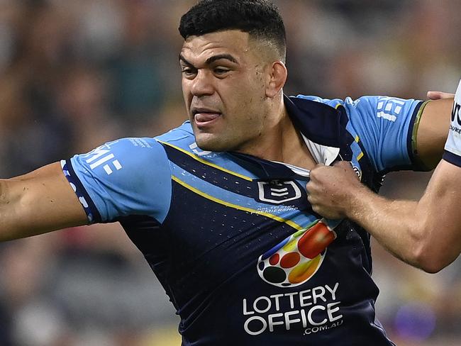 TOWNSVILLE, AUSTRALIA - APRIL 26: David Fifita of the Titans is tackled by Jaxon Purdue of the Cowboys during the round eight NRL match between North Queensland Cowboys and Gold Coast Titans at Queensland Country Bank Stadium, on April 26, 2025, in Townsville, Australia. (Photo by Ian Hitchcock/Getty Images)