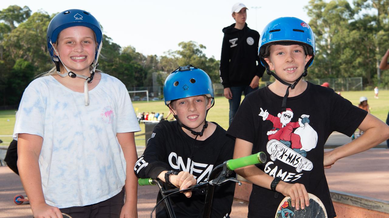 Faith Finlay, Gabe and Oliver Heuchan pose for a photo at Berowra skate park at the skate, scooter and BMX battle royale. (AAP IMAGE / MONIQUE HARMER)