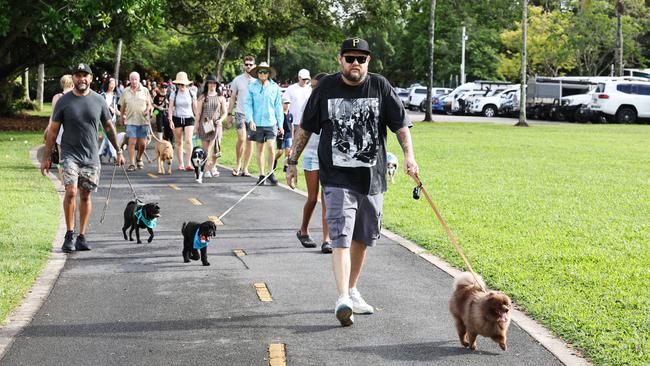 Brodie Chuck and his dog Motchi participate in the RSPCA's Million Paws Walk fundraiser, held along the Cairns Esplanade. Picture: Brendan Radke