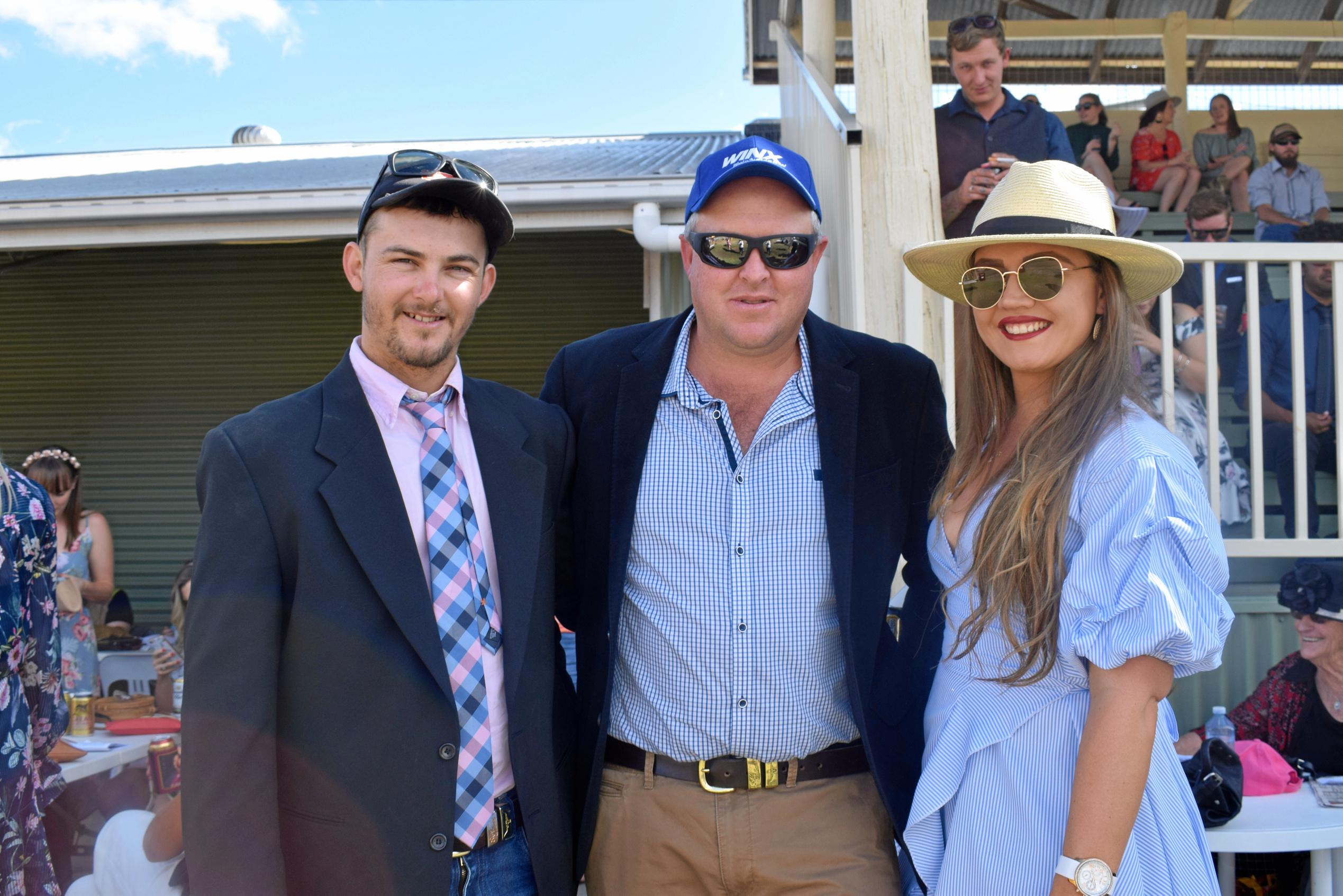 Alex Wilson, Anthony Hughes, and Brooke Higgins at the Tara Races October 6, 2018. Picture: Brooke Duncan