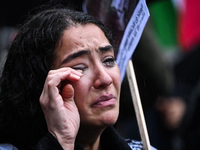 A protester cries as while taking part in a vigil outside Downing Street, in London. Picture: AFP