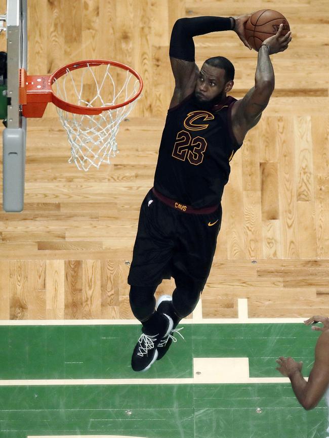 LeBron James soars to dunk against the Boston Celtics in May. Pic: AP/Charles Krupa.