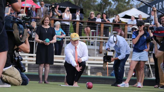 The PM playing bowls while on the election campaign in Torquay with Federal Member for Corangamite Sarah Henderson. Picture: Gary Ramage