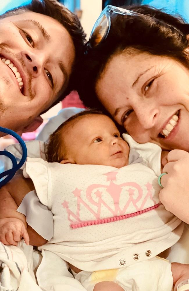 Blake and Chelsey were initially told Armani wouldn't survive her birth, but she's now a happy and otherwise healthy nine-month-old. Picture: BLAKE AND CHELSEY MILBY / CATERS NEWS