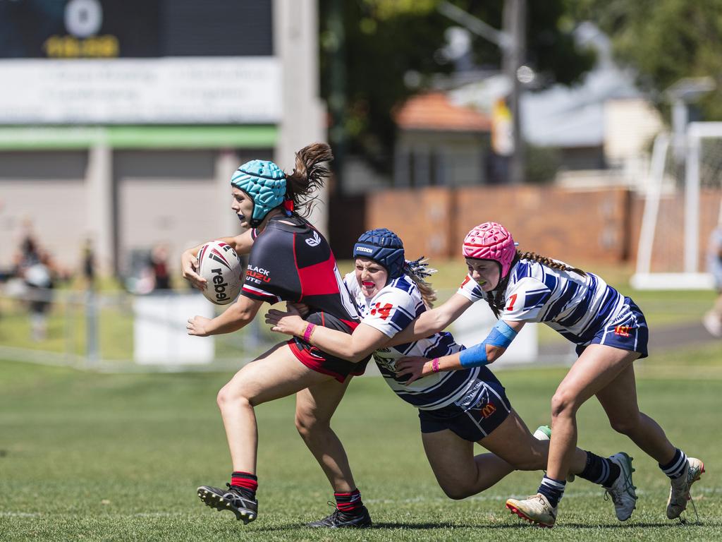 Matilda Binney of Valleys is tackled by Brothers players Millie Wolff (centre) and Miah Drennert in U15 girls Toowoomba Junior Rugby League grand final at Toowoomba Sports Ground, Saturday, September 7, 2024. Picture: Kevin Farmer