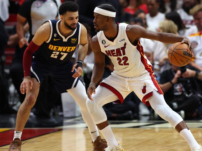 MIAMI, FLORIDA - JUNE 09: Jimmy Butler #22 of the Miami Heat dribbles against Jamal Murray #27 of the Denver Nuggets during the second quarter in Game Four of the 2023 NBA Finals at Kaseya Center on June 09, 2023 in Miami, Florida. NOTE TO USER: User expressly acknowledges and agrees that, by downloading and or using this photograph, User is consenting to the terms and conditions of the Getty Images License Agreement.   Mike Ehrmann/Getty Images/AFP (Photo by Mike Ehrmann / GETTY IMAGES NORTH AMERICA / Getty Images via AFP)