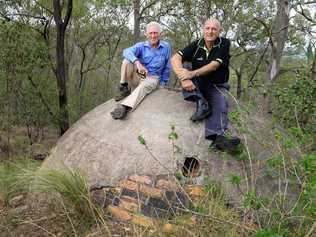 Ipswich Historical Society president Hugh Taylor and Cr Bruce Casos inspect a water tank at the site where Brynhyfryd stood at Blackstone Hill. Picture: Rob Williams