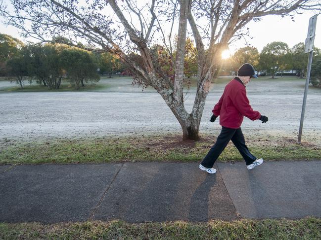 First cold frosty day of Autumn. Early morning frost in Toowoomba. People braving the chilly conditions to exercise along a path at East Creek, Centenary Heights. 30th May 2016. pic David Martinelli