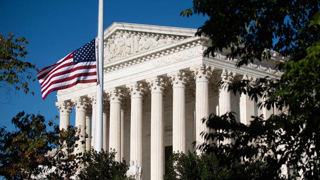 The American flag flies at half staff for late US Supreme Court Justice Ruth Bader Ginsburg outside the US Supreme Court in Washington. Picture: Saul Loeb/AFP