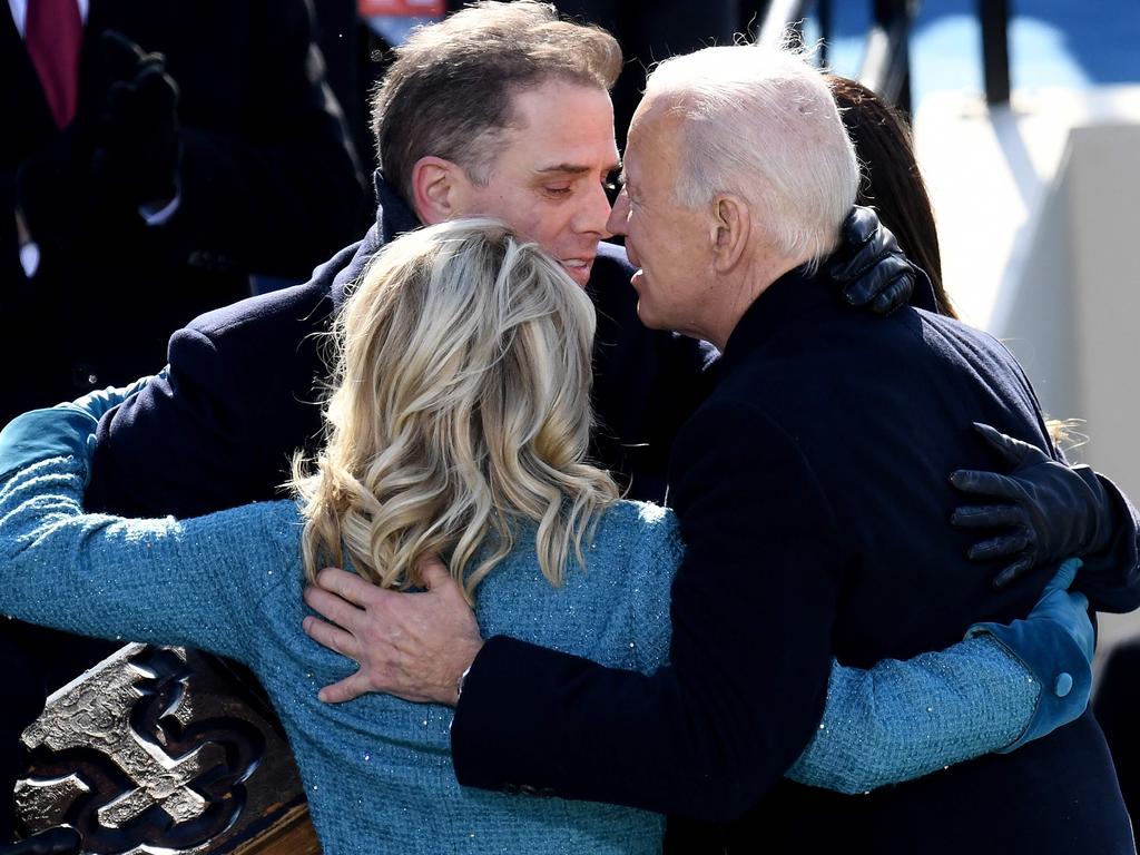 US President Joe Biden (R) hugs his son Hunter Biden (C) and US First Lady Jill Biden after being sworn in as the 46th US President. Picture: AFP