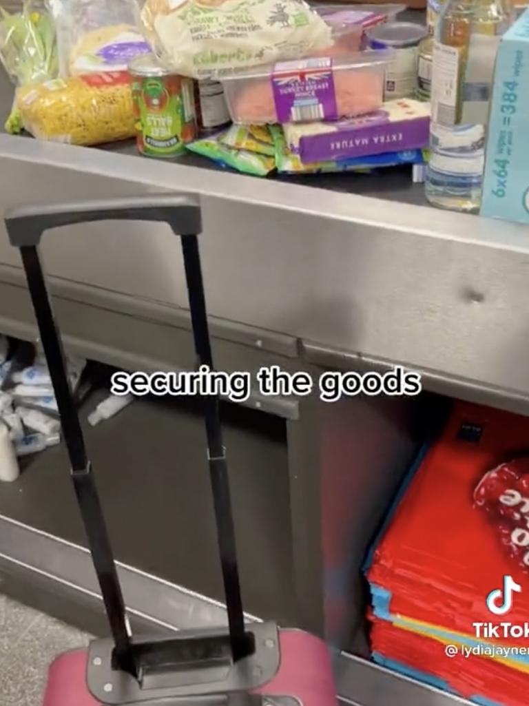 The woman said she was laughed at by a man for having a suitcase at the checkout. Picture: TikTok/@lydiajaynem