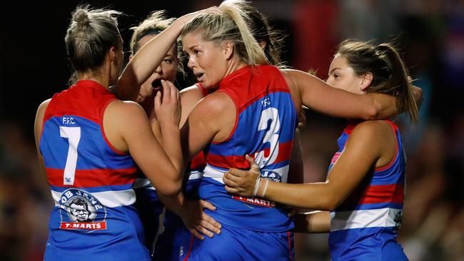 Katie Brennan celebrates with teammates on Saturday night. Picture: Getty Images