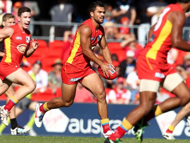 Karmichael Hunt on the burst for the Suns.