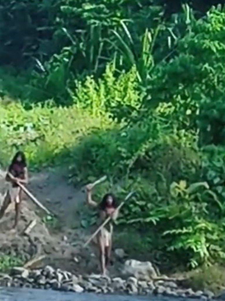 Last year footage of two Hongana Manyawa men defending their land with spears and weapons went viral. Picture: Supplied