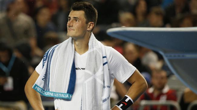 MELBOURNE, AUSTRALIA — JANUARY 20: Bernard Tomic of Australia looks on as light rain begins to fall in his third round match against Daniel Evans of Great Britain on January 20, 2017 in Melbourne, Australia. (Photo by Darrian Traynor/Getty Images)