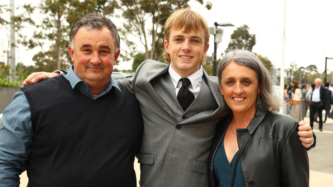 Tully Searle with parents Paul and Sam at the Belmont High School year 12 graduation at GMHBA Stadium. Picture: Alison Wynd