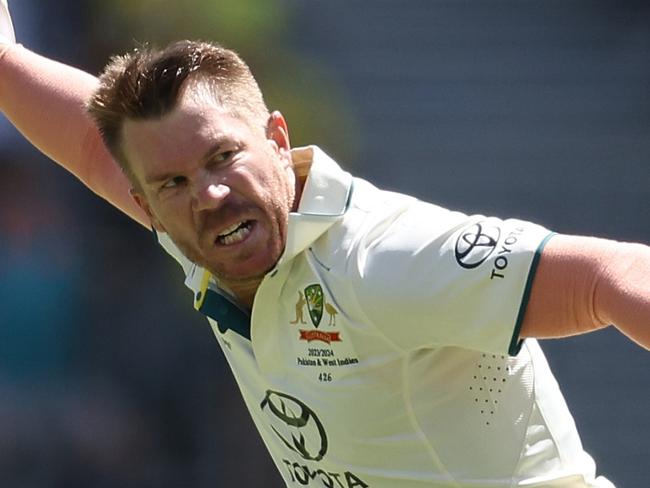 PERTH, AUSTRALIA - DECEMBER 14: David Warner of Australia celebrates after scoring a century during day one of the Men's First Test match between Australia and Pakistan at Optus Stadium on December 14, 2023 in Perth, Australia. (Photo by Paul Kane/Getty Images)