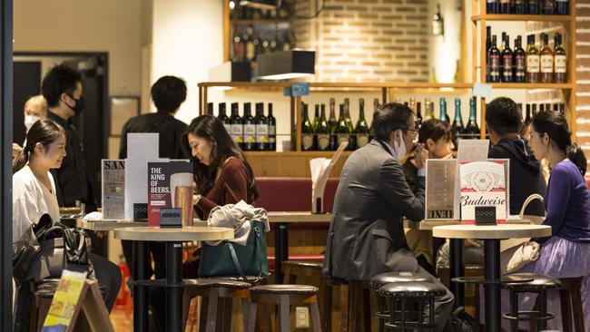 People enjoy drinks and food in the Shimbashi area of Tokyo, Japan. Picture: Getty Images