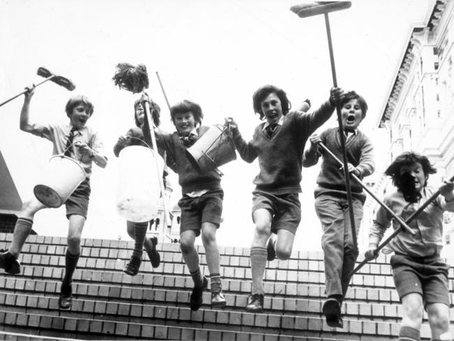 Sacred Heart College Year 7 students high on chocolate frogs, Toobs and licorice demand more sugar while brandishing cleaning implements in 1977. Picture from the book ‘The Endless Playground, celebrating Australian childhood’