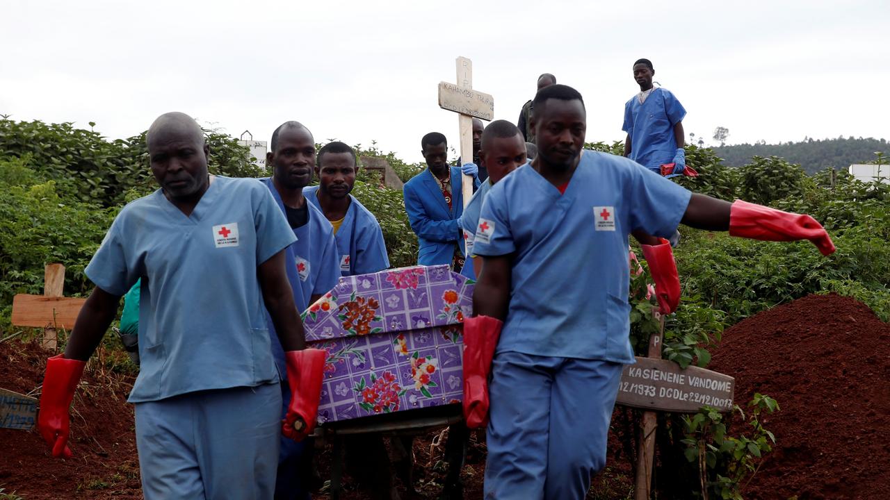 Red Cross workers carry the coffin of a woman who died of ebola in the Democratic Republic of Congo in 2019. Picture: Reuters/Baz Ratner