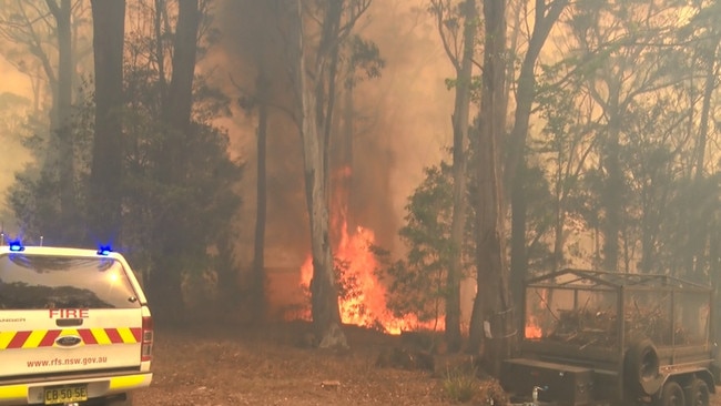 A spot fire breaks out at the main fire front Picture: NSWRFS