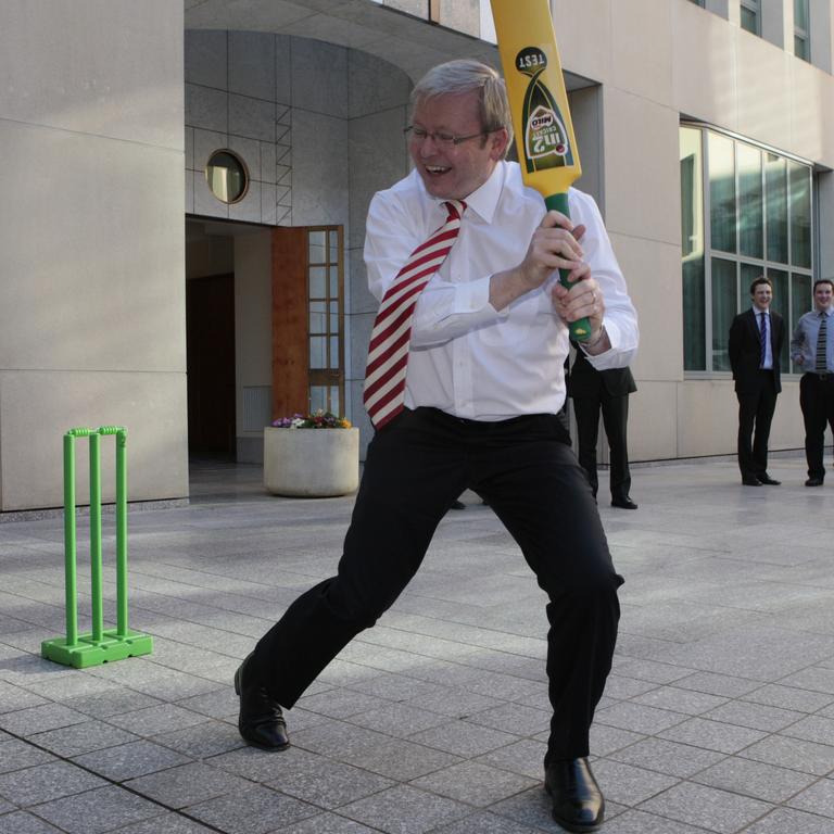 Kevin Rudd shows off his cricketing ability to the Australian Test cricket team in the courtyard of his office at Parliament House in Canberra in 2008. 