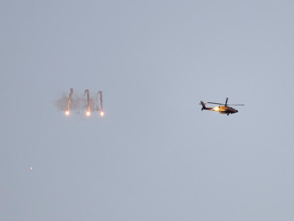 An Israeli army helicopter firing flares above the Gaza Strip. Picture: AFP