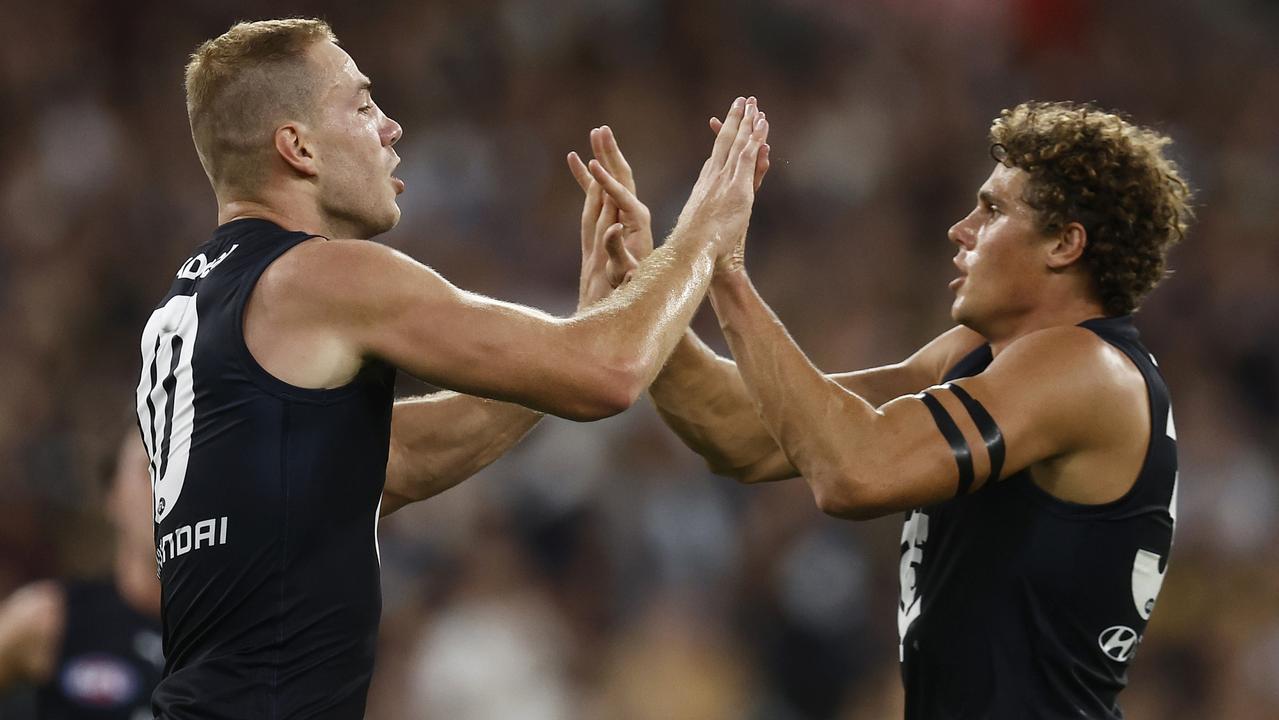 MELBOURNE, AUSTRALIA - MARCH 16: Harry McKay of the Blues (L) celebrates with Charlie Curnow of the Blues after kicking a goal during the round one AFL match between Richmond Tigers and Carlton Blues at Melbourne Cricket Ground, on March 16, 2023, in Melbourne, Australia. (Photo by Daniel Pockett/Getty Images)