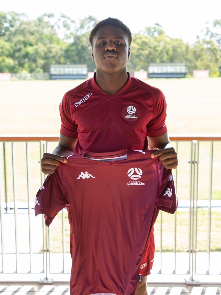 Gold Coast Knights player David Bolongi accepts his Queensland U16 jersey.