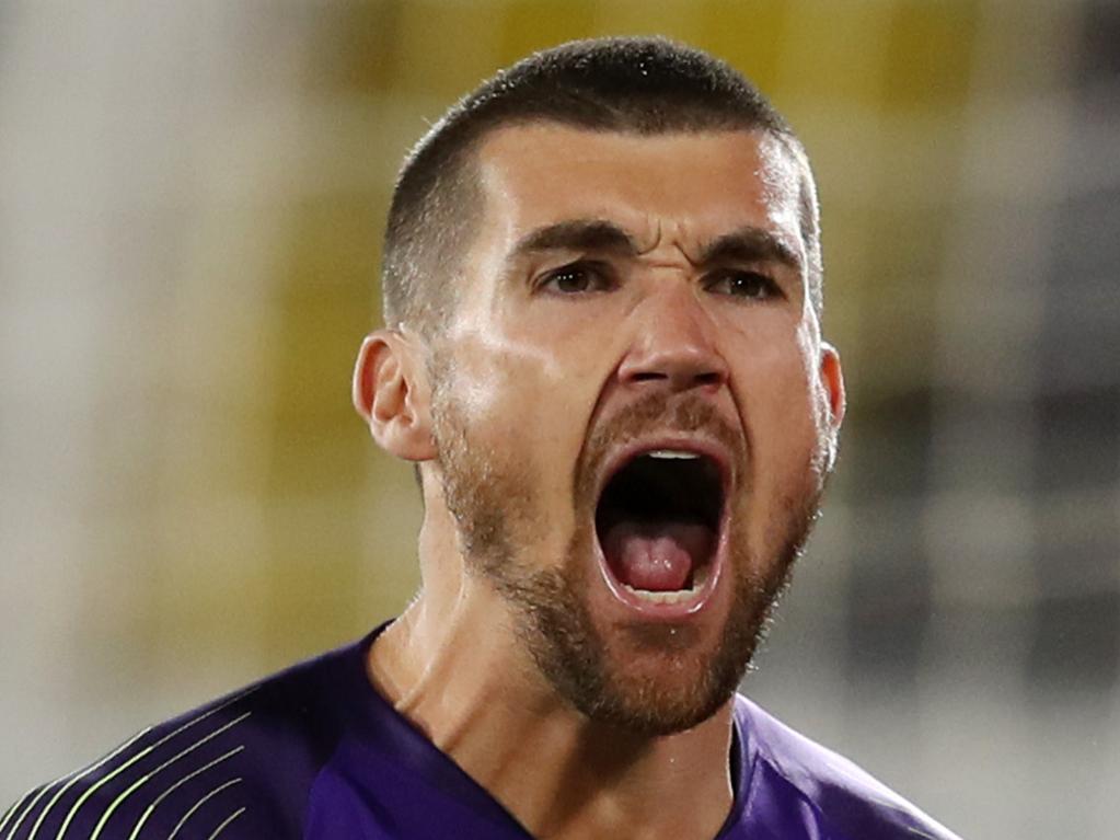 AL AIN, UNITED ARAB EMIRATES - JANUARY 21: Mat Ryan of Australia celebrates after saving the fourth penalty from Marat Bikmaev of Uzbekistan (not pictured) in the penalty shoot out during the AFC Asian Cup round of 16 match between Australia and Uzbekistan at Khalifa Bin Zayed Stadium on January 21, 2019 in Al Ain, United Arab Emirates. (Photo by Francois Nel/Getty Images)