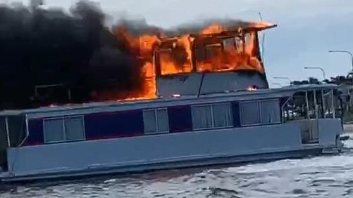 A houseboat on fire at Labrador last month. Picture from footage by Ric Gibson