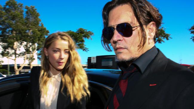 Amber Heard and Johnny Depp arriving at court in the Gold Coast in 2016. Picture: Patrick Hamilton / AFP