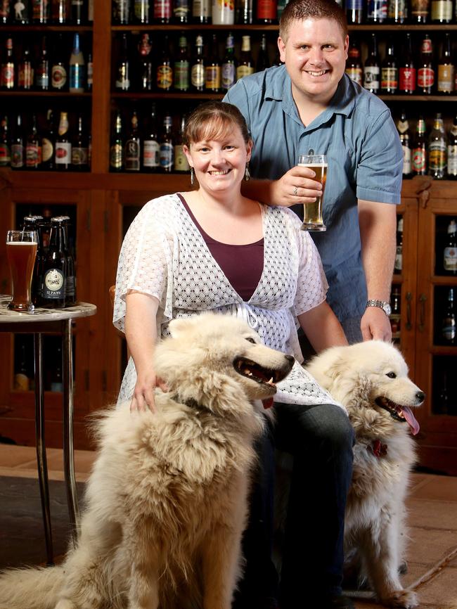 Simon Dunstone and Kate Henning — and dogs Cooper and Mia — at their Myponga micro brewery, the Smiling Samoyed. Picture: Calum Robertson