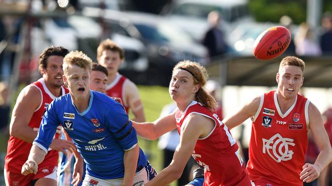 Ocean Grove’s Kye Annand tries to shut down Barwon Heads’ Jake Barlow.