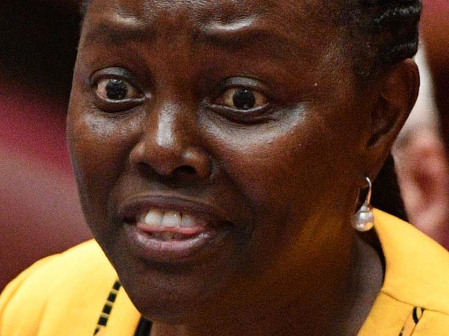 Liberal Senator Lucy Gichuhi reacts to Katter's Australian Party Senator Fraser Anning first speech in the Senate chamber at Parliament House in Canberra, Wednesday, August 15, 2018. (AAP Image/Mick Tsikas) NO ARCHIVING