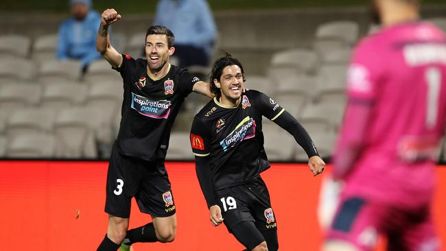 Newcastle’s Kosta Petratos (R) celebrates his 90th minute matchwinner against Sydney FC.