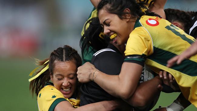 Australia's Mhicca Carter and Atasi Lafai make a tackle during the Australian Wallaroos v New Zealand Ferns Bledisloe Cup match four years ago.