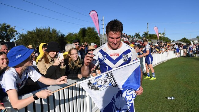 18/05/2023 - Then Bulldogs captain Josh Jackson signs autographs after last year’s game with the Cowboys at Salter Oval. Picture: NRL Photos