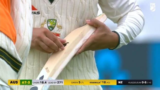 Usman Khawaja removes dove from new bat