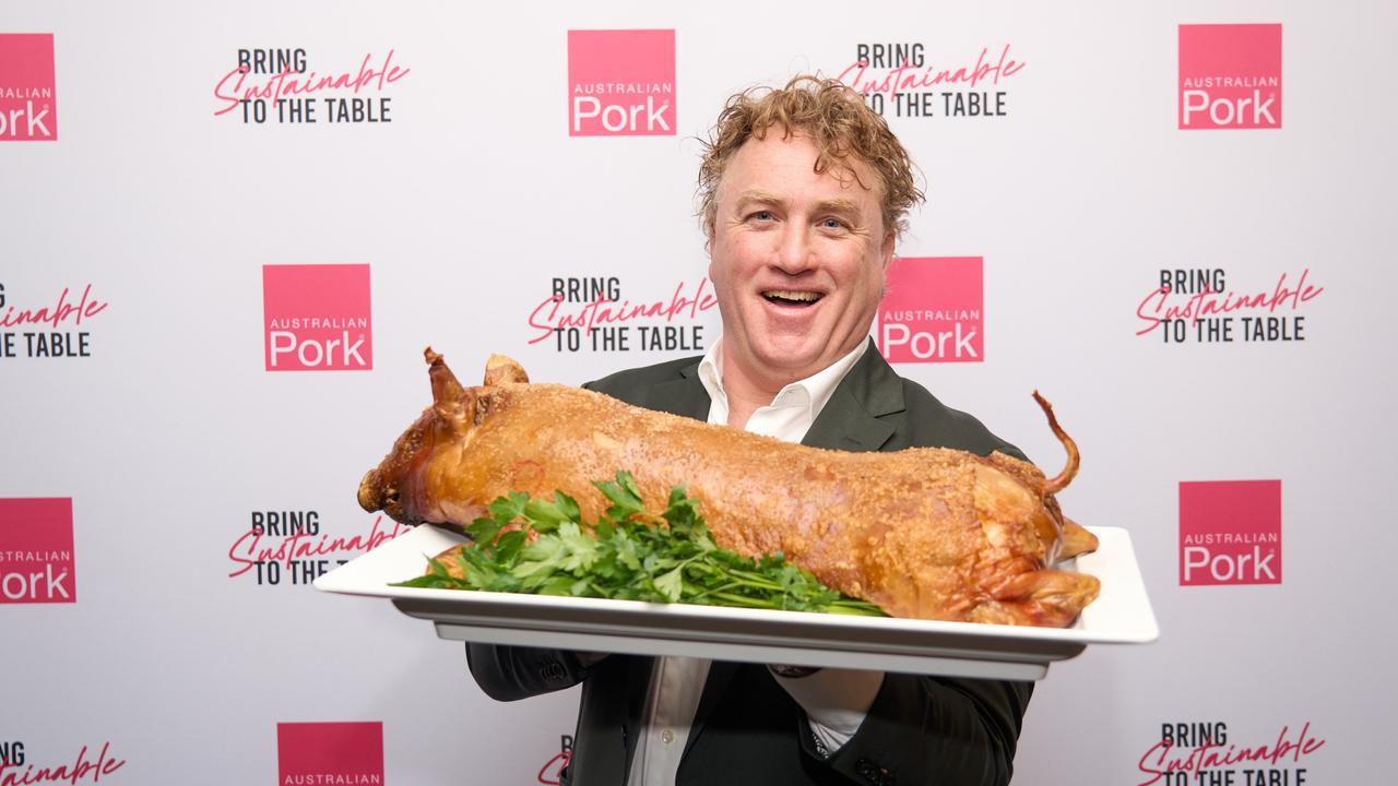 Celebrity chef Adrian Richardson with a suckling pig.