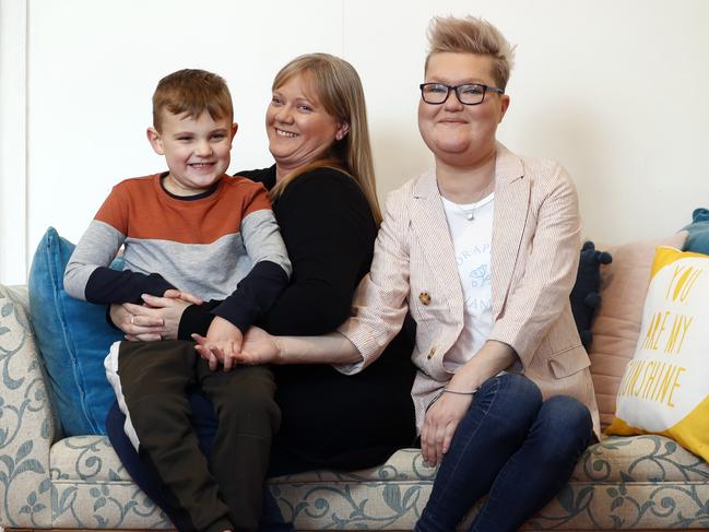 Miranda Hill (right) with Harry and Megan Hill (centre), who was the surrogate mother. Picture: Sam Ruttyn