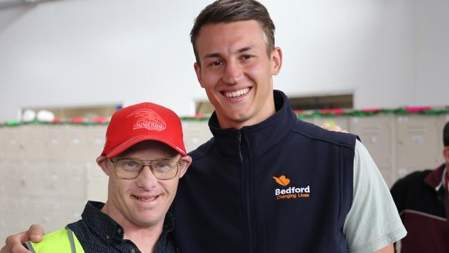 Adelaide Crows star defender and new Bedford Ambassador Tom Doedee with Bedford employee Jarred Henneker.