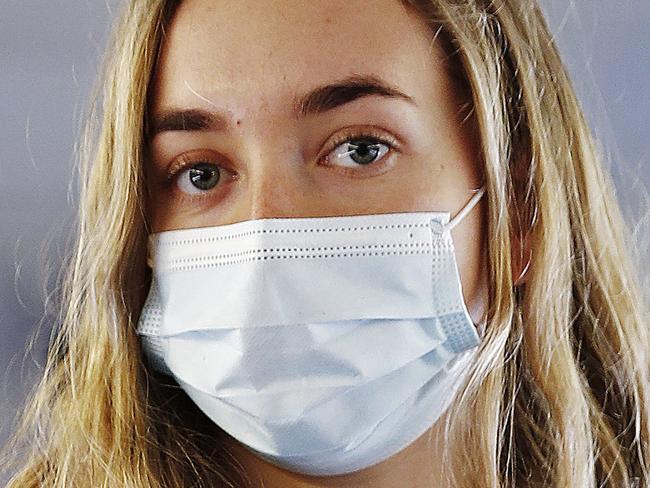 WEEKEND TELEGRAPH - 17/6/21Lily Leighton, 22yr old from Port Macquarie pictured wearing a face mask whilst on a train at Central Station in SYdney after a recent outbreak of COVID-19. Picture: Sam Ruttyn